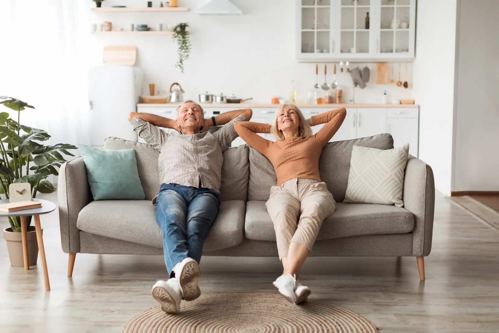 Couple relaxing together on the sofa at home