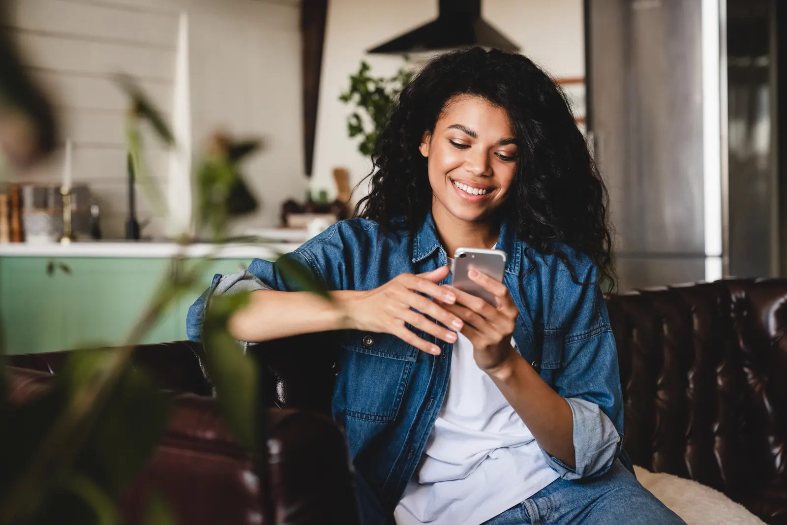 Woman at home checking her phone